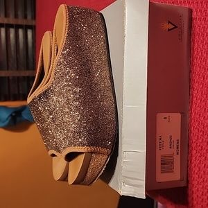 Bronze, brownish color, worn a couple times, stretchy, sparkly material